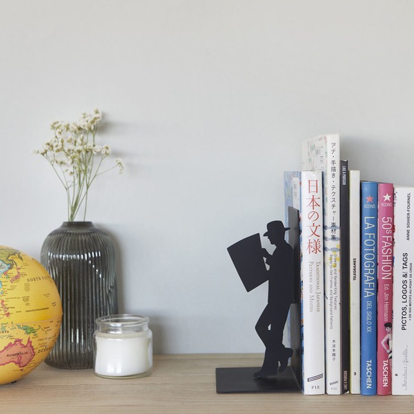 Leaning man bookend on desk